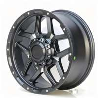 Built for abuse: matte black with machined Y-spokes, beadlock-style ring, 6-lug truck pattern. This is what Land Cruiser and F-150 owners are buying.